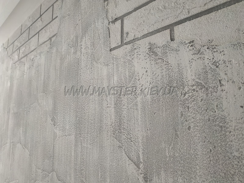 Імітація старої цегляної стіни з цементною штукатуркою, що напівобвалилася, та побілкою, що обсипалася фото